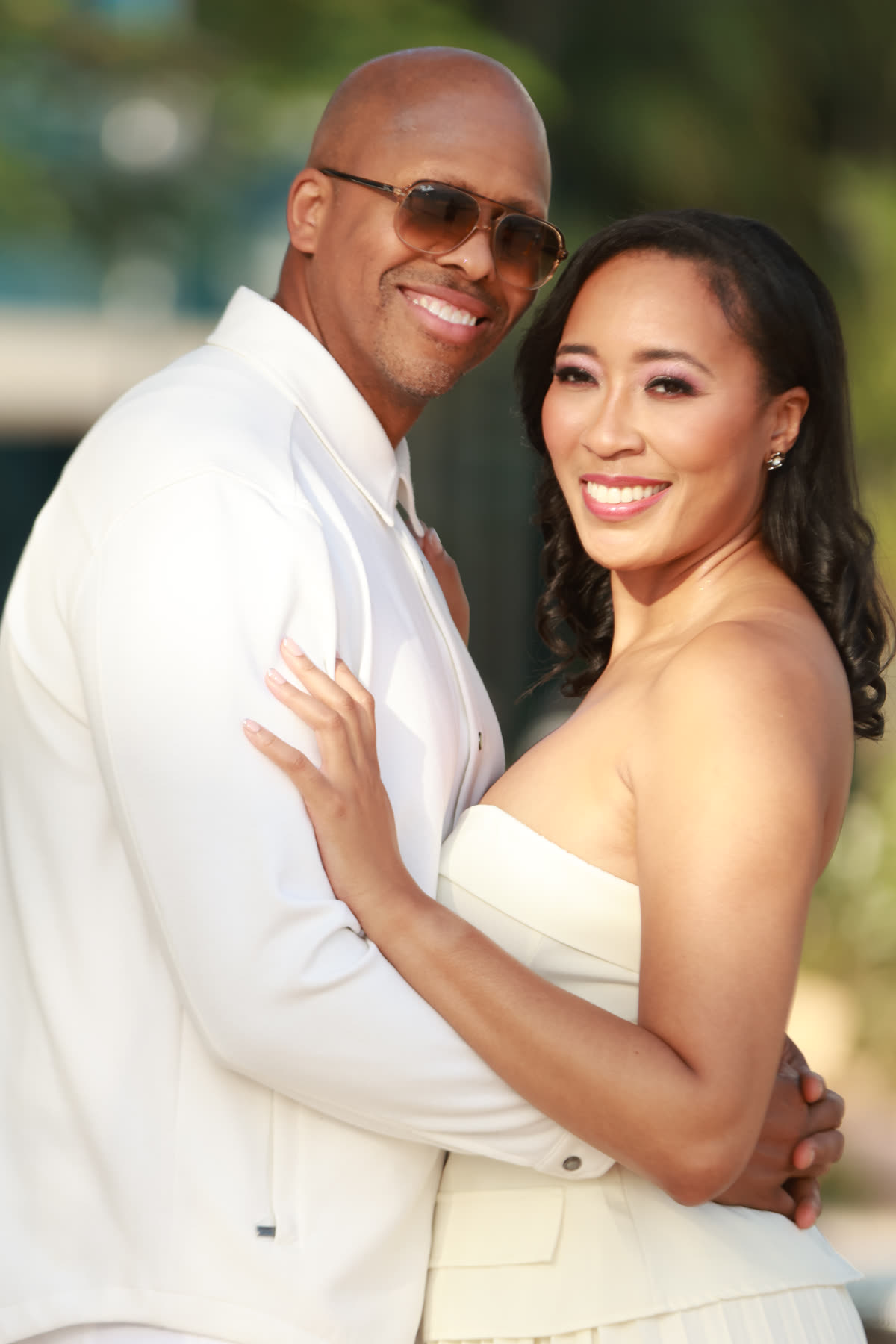 Breanna and Rob, both in white, smiling